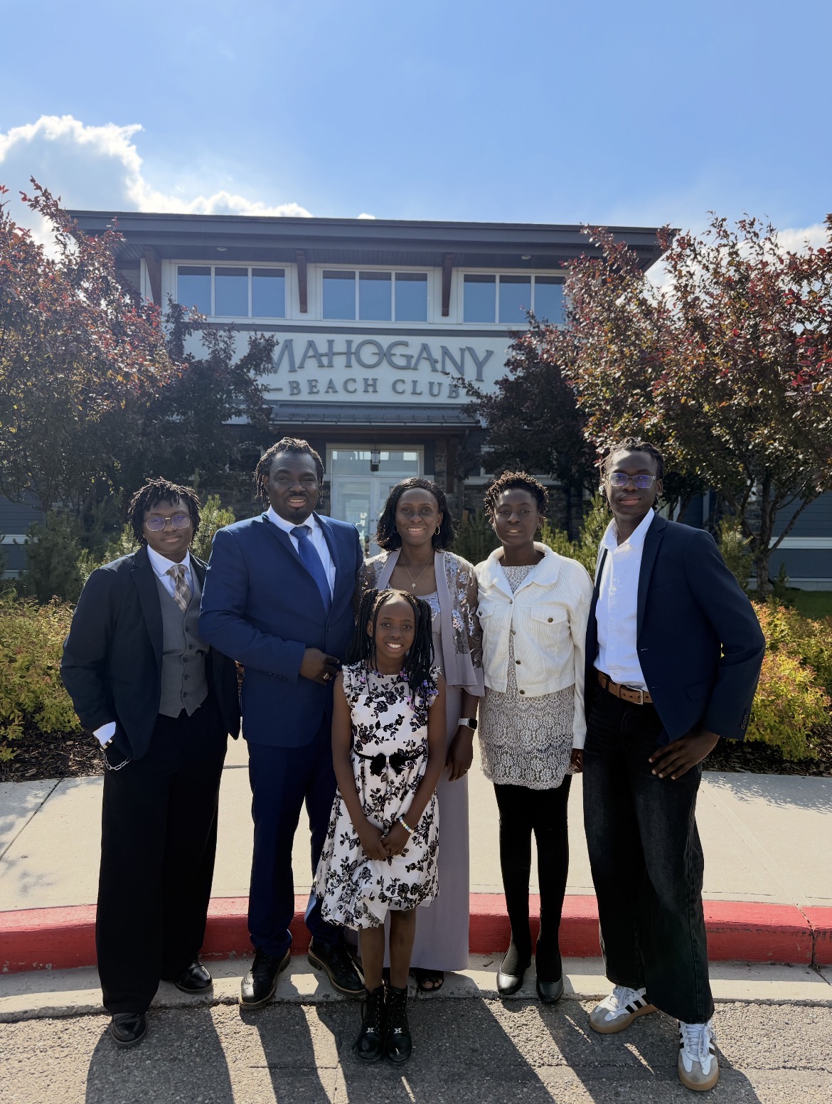 Click to swap photos Alabi Adenekan with his family